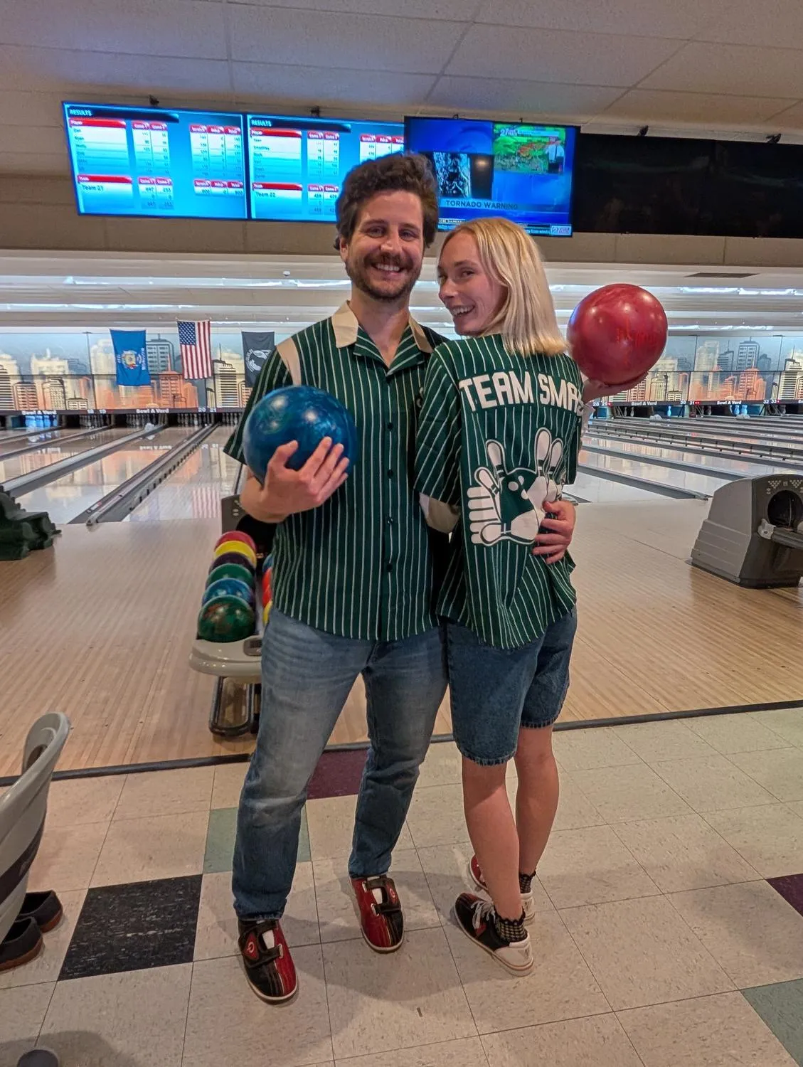 Sean and friends at a bowling alley, mid-celebration.